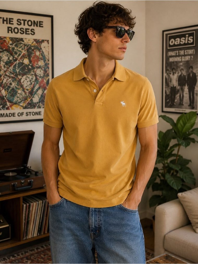 AI-generated mockup of a mustard polo shirt on a male model in a vintage living room